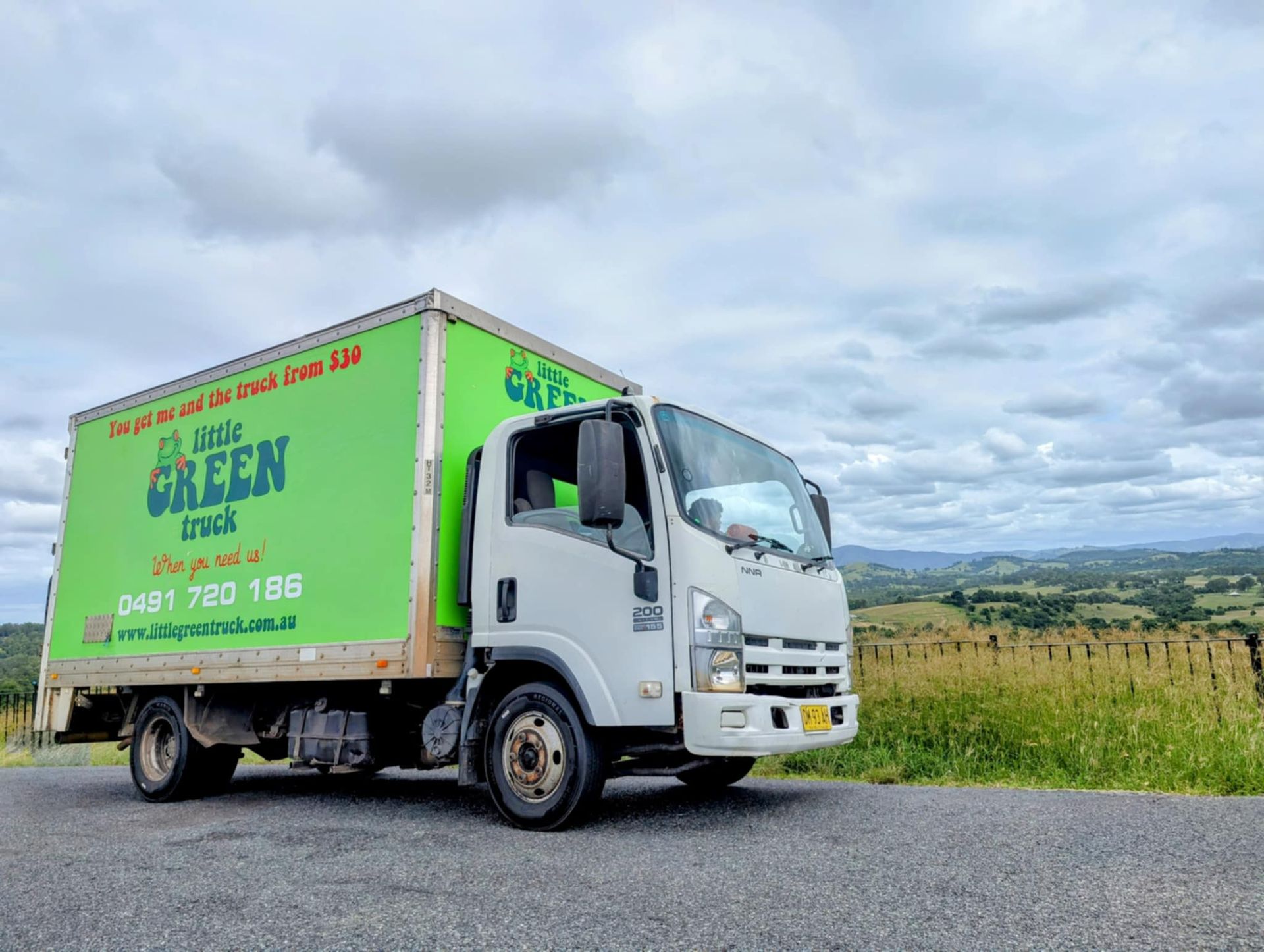 A Green Goodyear Truck is Parked in Front of a Building — Little Green Truck Port Macquarie in Port Macquarie, NSW