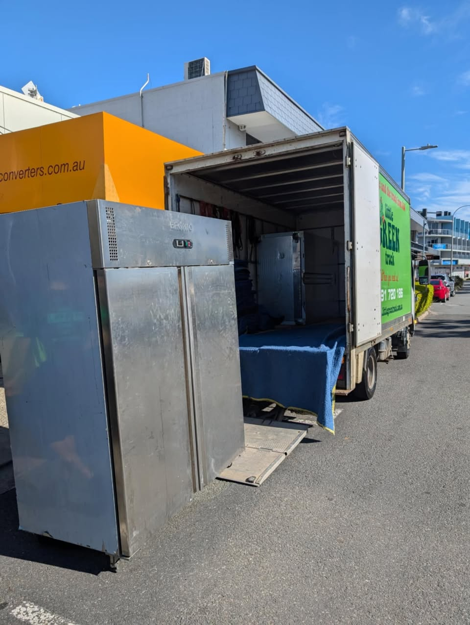 The Back of a Moving Truck Filled With Furniture and Blankets — Little Green Truck Port Macquarie in Port Macquarie, NSW