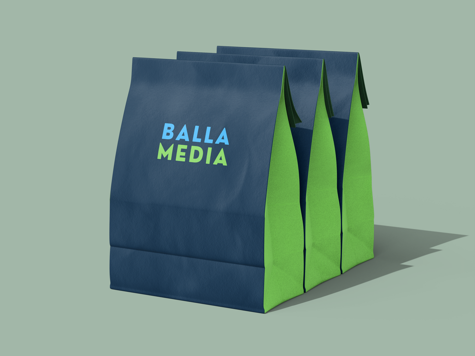 Blue and green branded paper bag with “BALLA MEDIA” text on a plain background