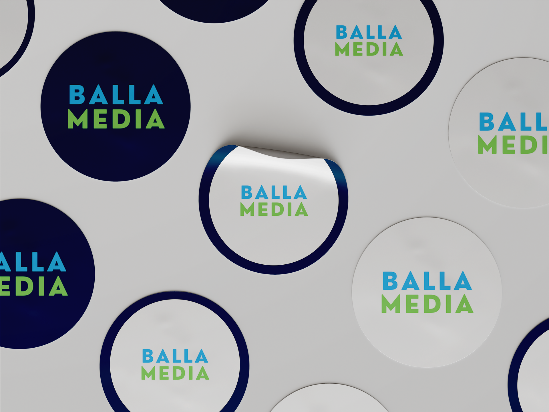 Repeated circular BALLA MEDIA logos in blue, green, and white on a light background