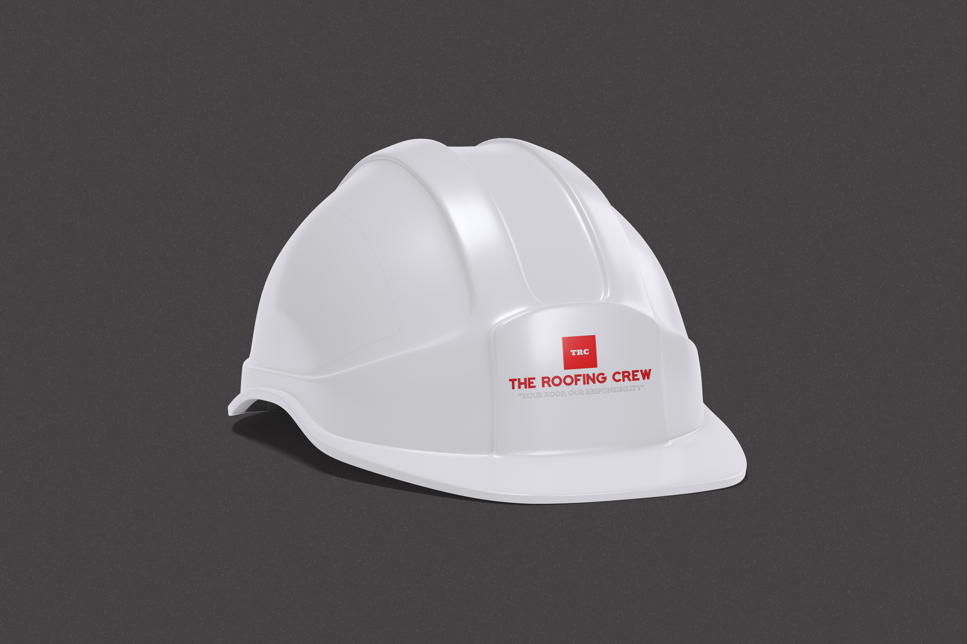 White hard hat with red logo on a dark gray background