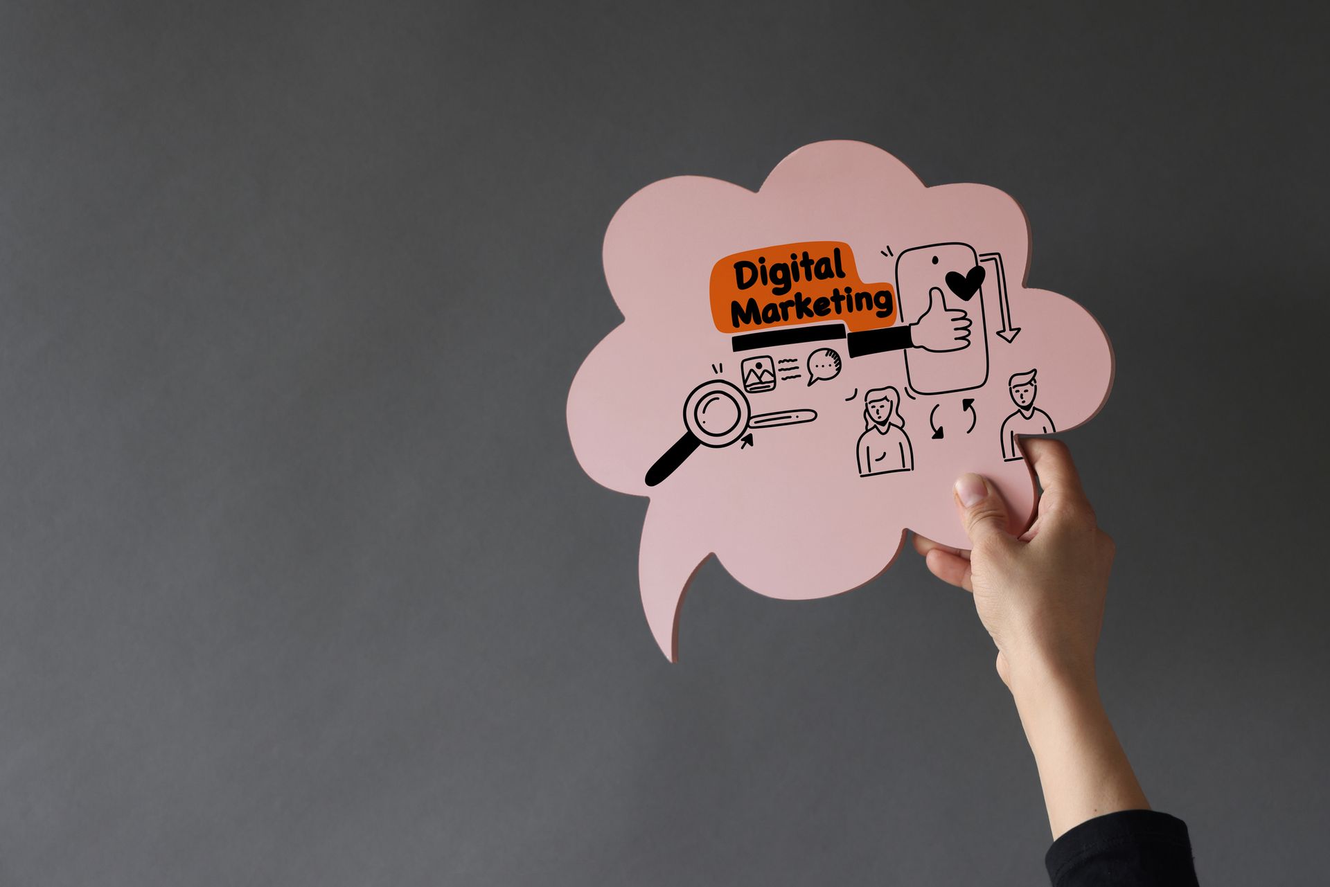 A person is holding a speech bubble that says `` digital marketing ''.