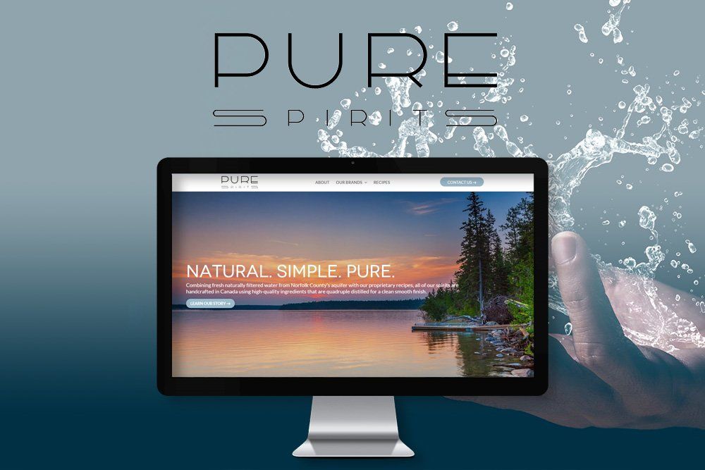 A hand is holding a computer monitor that says pure on it