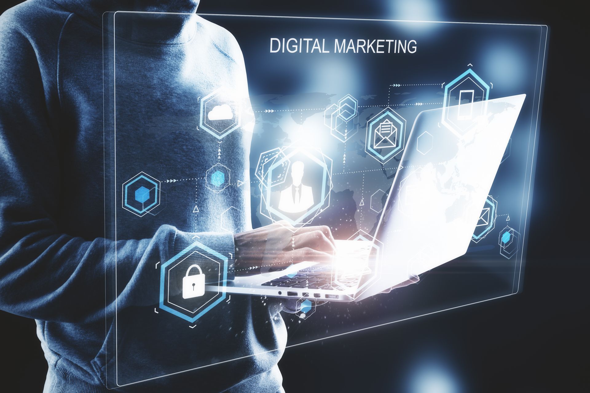 Person using laptop with digital marketing holographic overlay, icons and text.