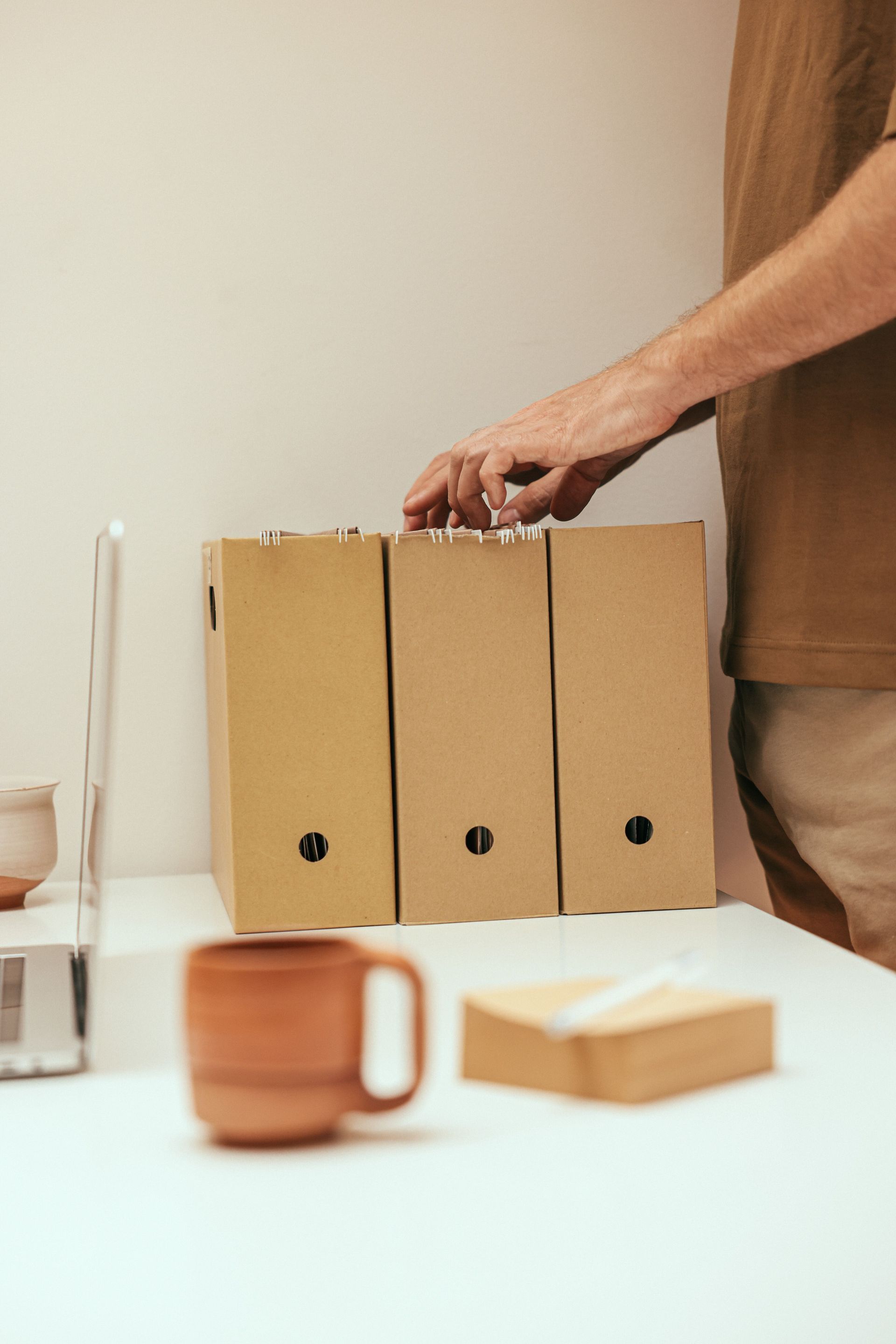 Filing boxes of records being organised during a law firm trust account cleanup