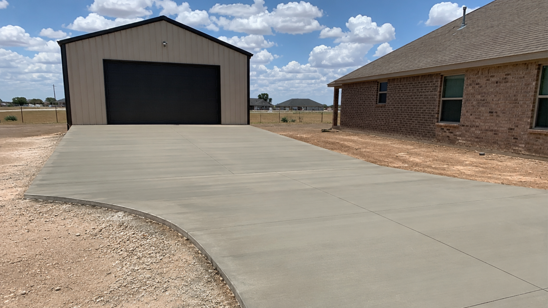 Concrete apron connecting a residential shop to a driveway in Midland TX