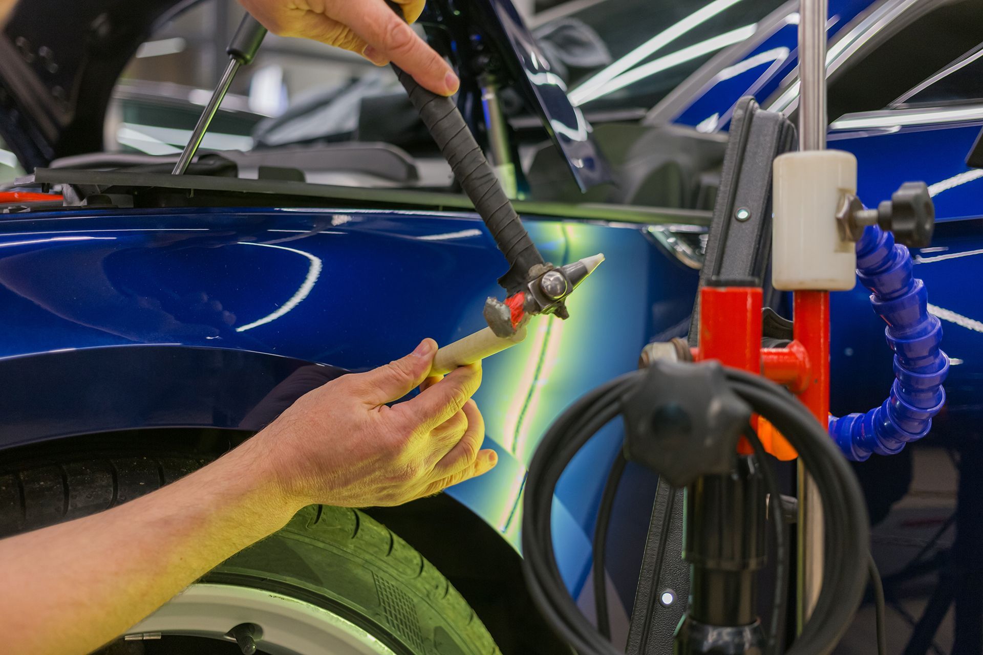 Removing Dent on Blue Car