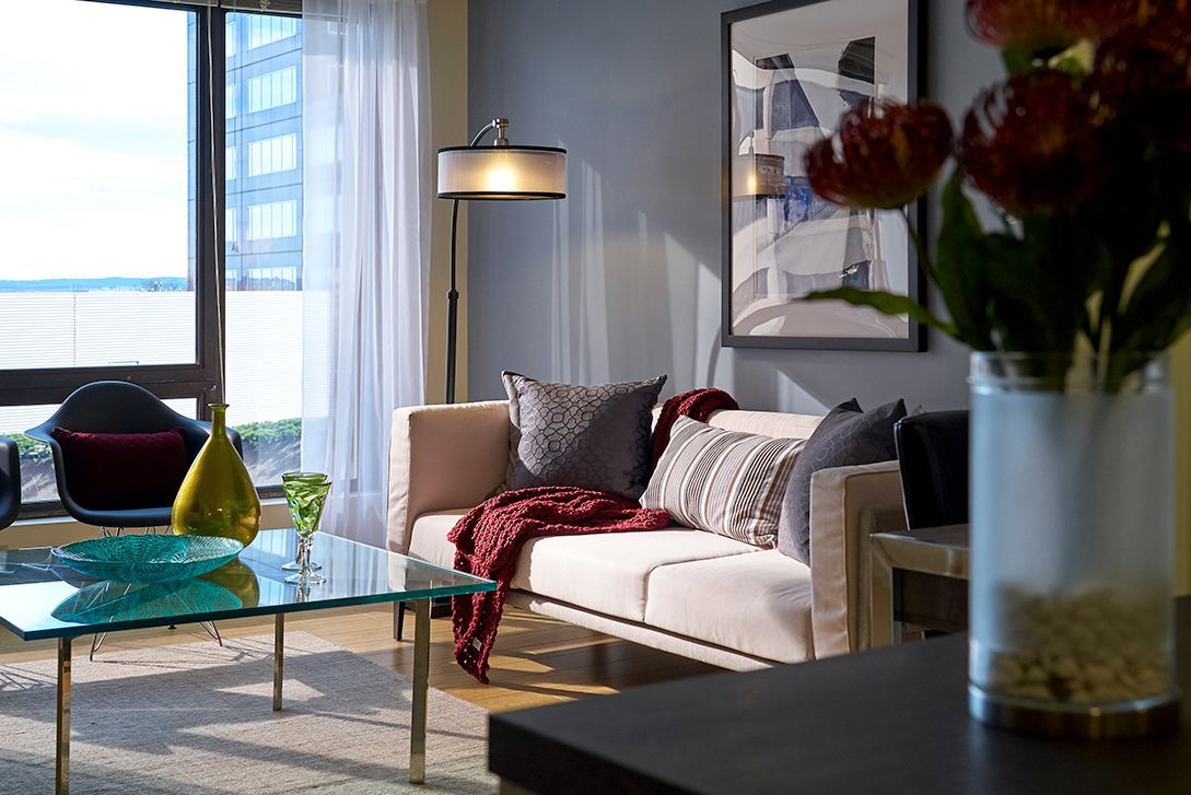 A living room filled with furniture and a fireplace.