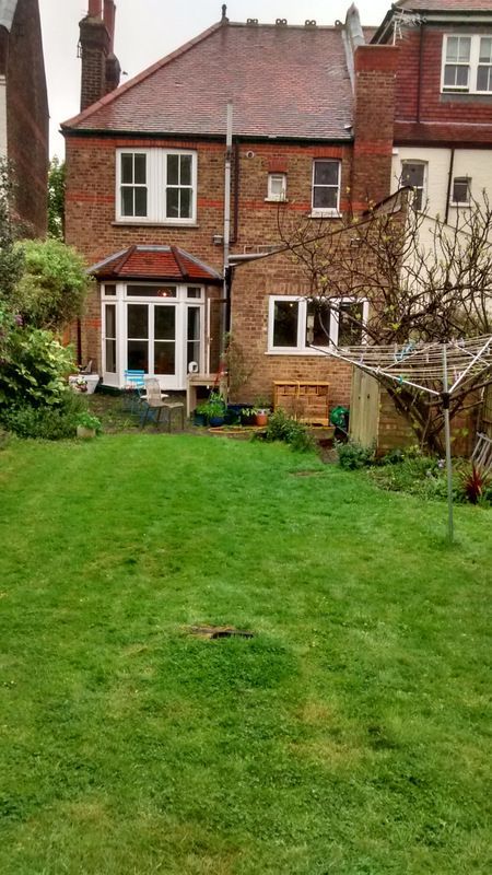 Garden before looking towards the house with washing line in foreground