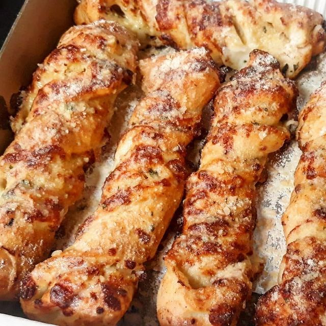 Tray of baked garlic twists