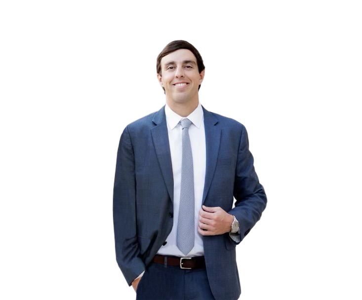 Two individuals in formal business suits smiling for a portrait against a white background.