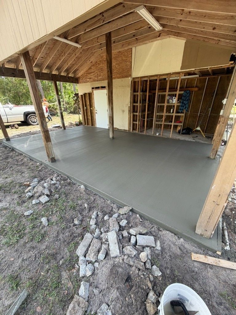A concrete walkway with stairs leading up to a house