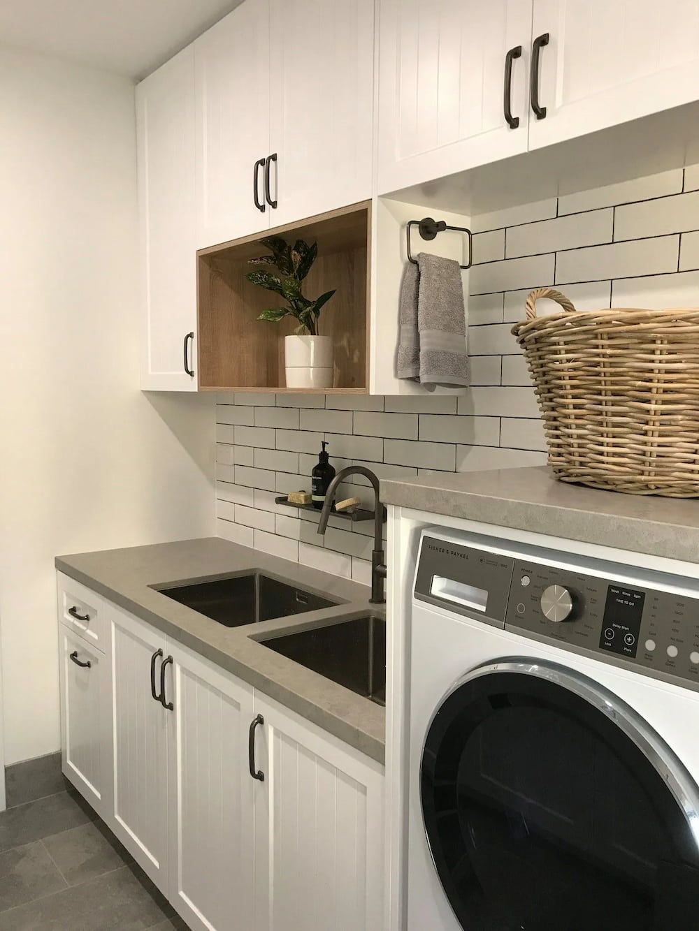 A Laundry Room With A Sink , Washer And Dryer — D & L Custom Cabinets In South Murwillumbah, NSW