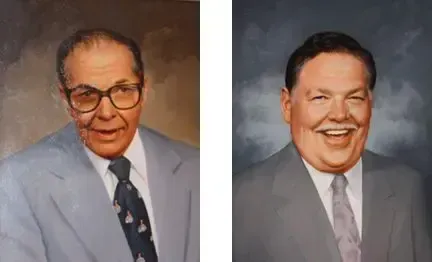 Two men in suits, one with glasses, the other smiling widely. Neutral backgrounds.