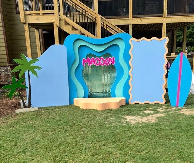 Surf-themed party backdrop with the name