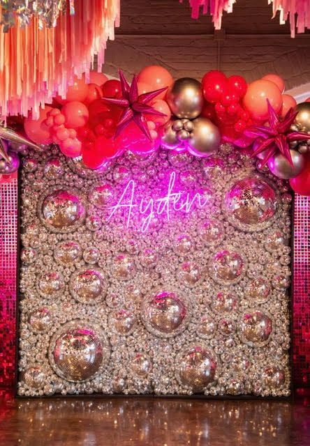 Party backdrop with silver sequin wall, neon