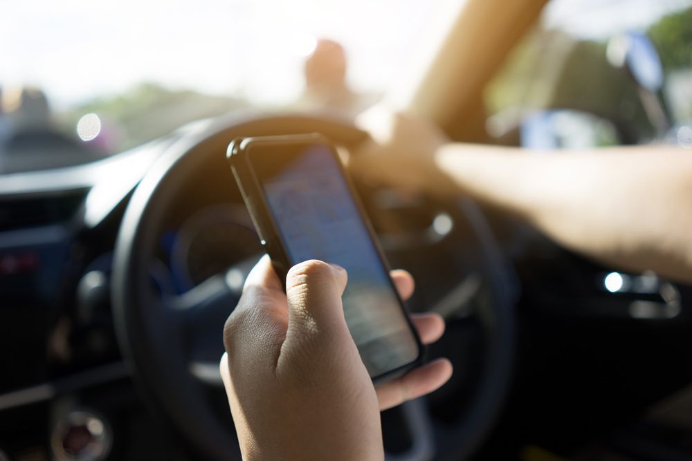 Driver Looking In The Phone — Puyallup, WA — McCallum License Agency