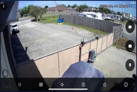View of the Wildman Warehouse main entrance gate and driveway