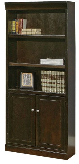 Dark brown wooden bookcase with shelves and cabinet doors, filled with books.