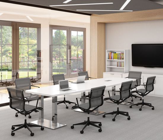 Modern conference room with long white table, gray chairs, and large TV screen.