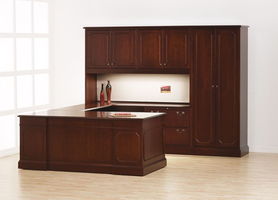Dark wood office furniture set including a desk, hutch, and storage cabinets in a white room.