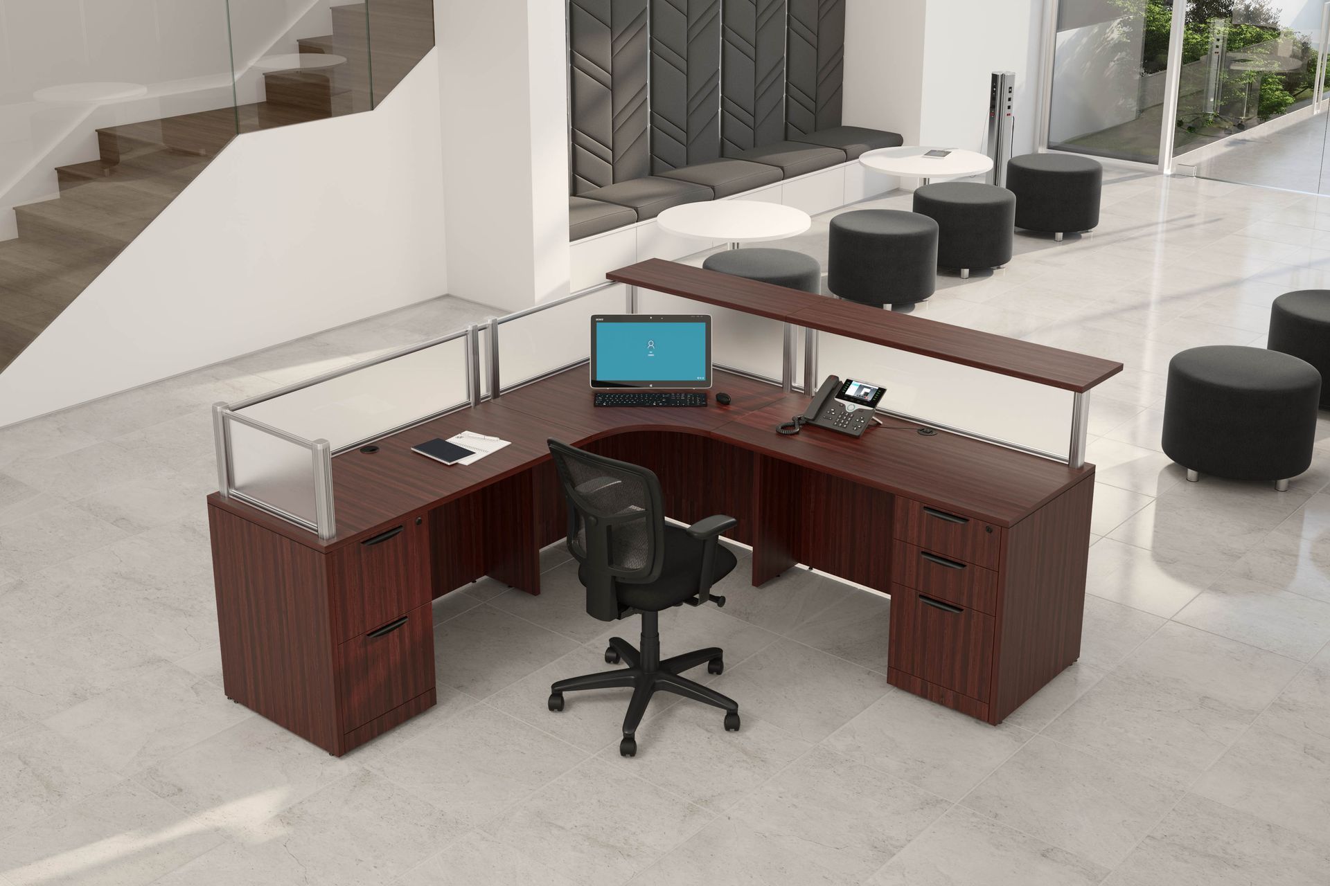 Dark wood reception desk in a modern office, with a laptop, phone, and chair.