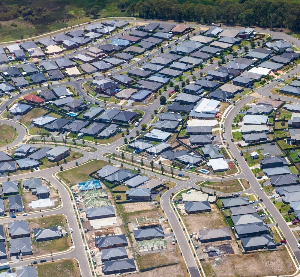 An Aerial View of a Residential Area With Lots of Houses — Freedom Flooring Pty Ltd in Adamstown, NSW
