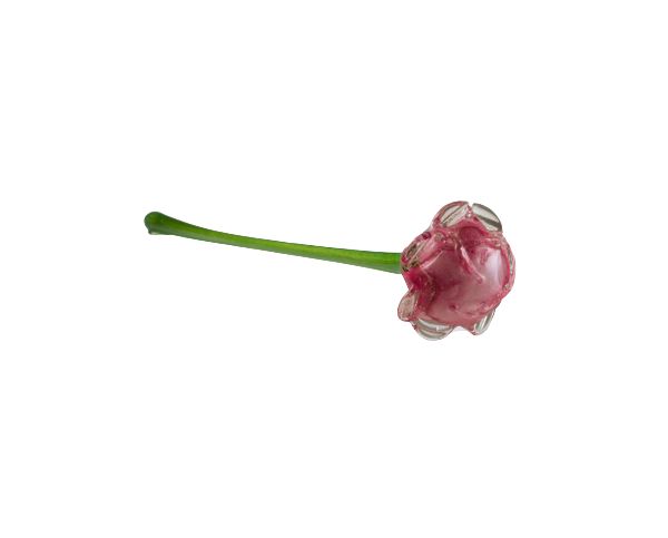 Pink glass flower bead with a green stem on a white background
