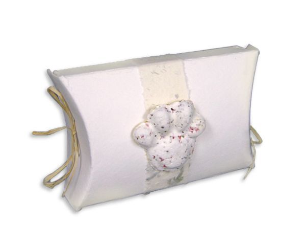 White pillow with a central moldy stain and beige side ties on a white background
