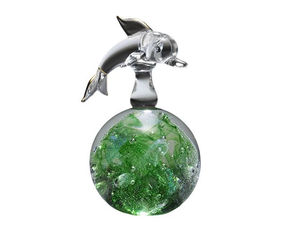 Silver dolphin figurine atop a green glass sphere pendant