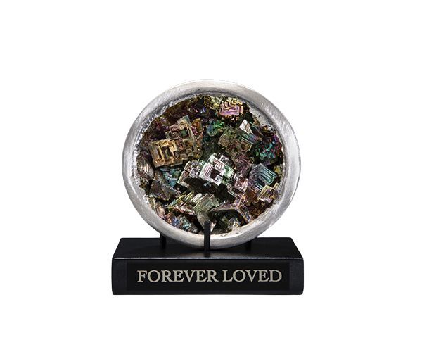 Memorial keepsake with “FOREVER LOVED” plaque and a round display of small photo fragments