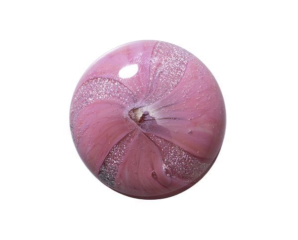 Pink glittery round ornament with a small shiny highlight on a white background