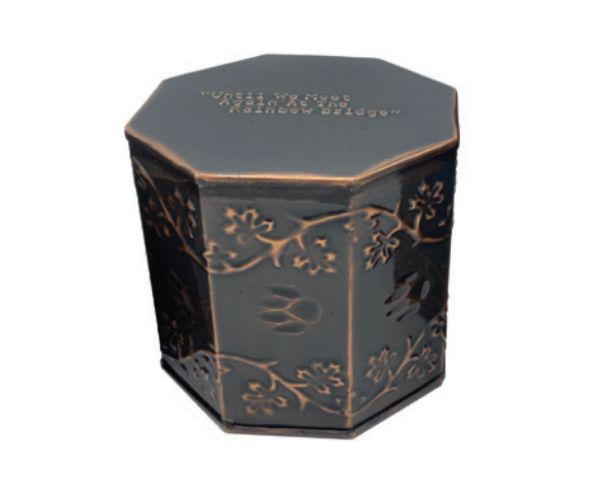 Black hexagonal decorative tin with gold floral trim and lid text