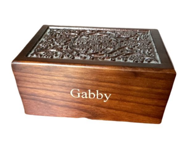 Wooden keepsake box with ornate metal lid and the name “Gabby” on the front.