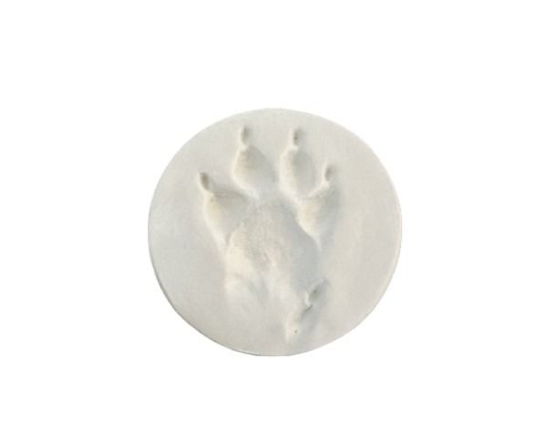 White circular disc with an embossed animal paw print