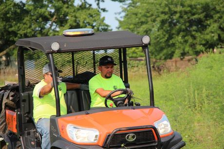 Harlow Enterprises Incorporated worker driving a vehicle