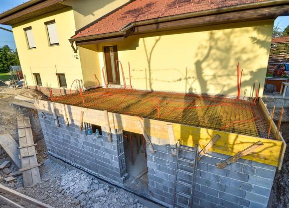 a house under construction in the middle of the day