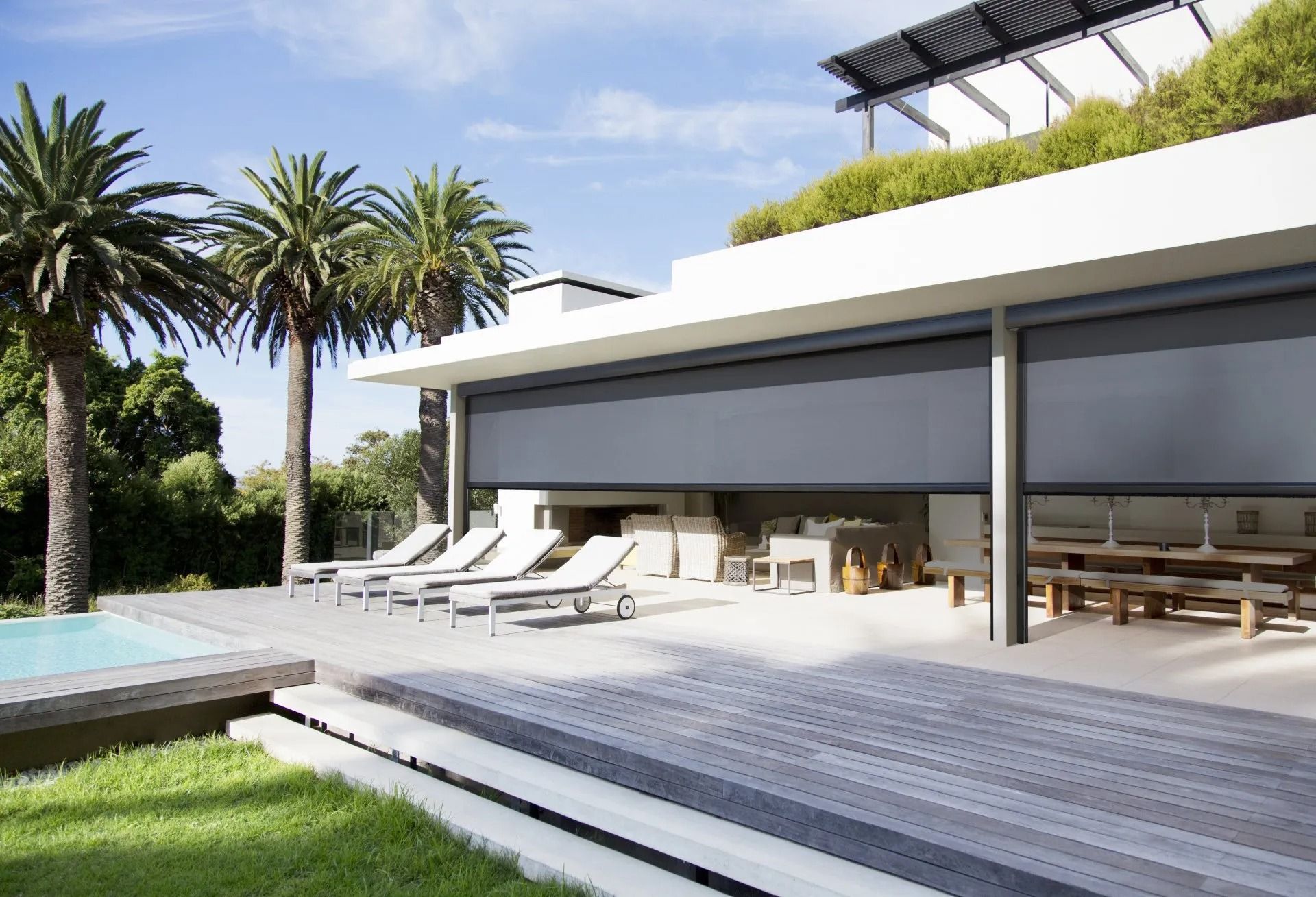 Outdoor Patio With Pool, Deck, and Partially-shaded Dining Area With Retractable Sun Shades.— Red Door Decor In Dubbo, NSW