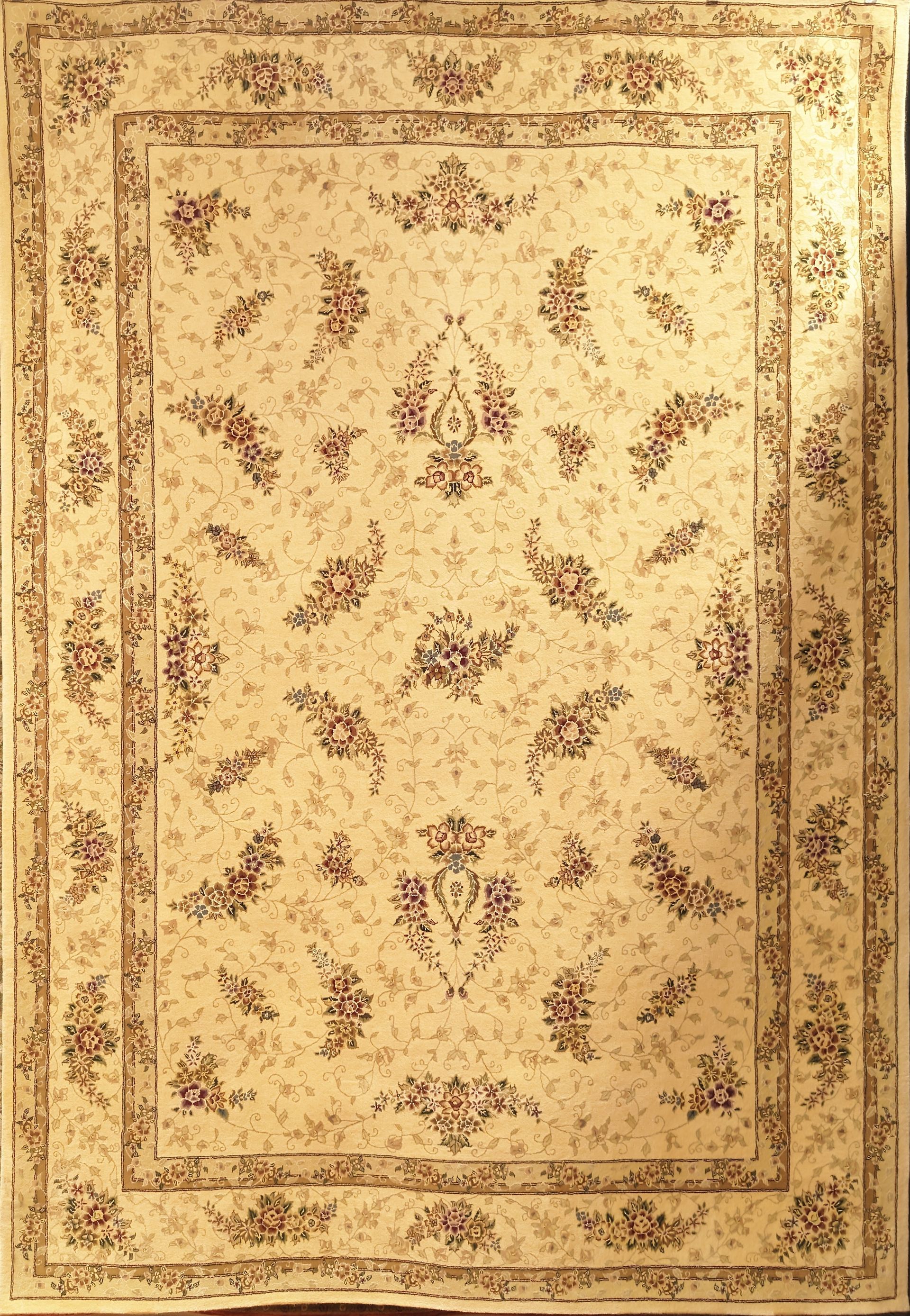 Beige vintage rug with brown floral border and central botanical pattern