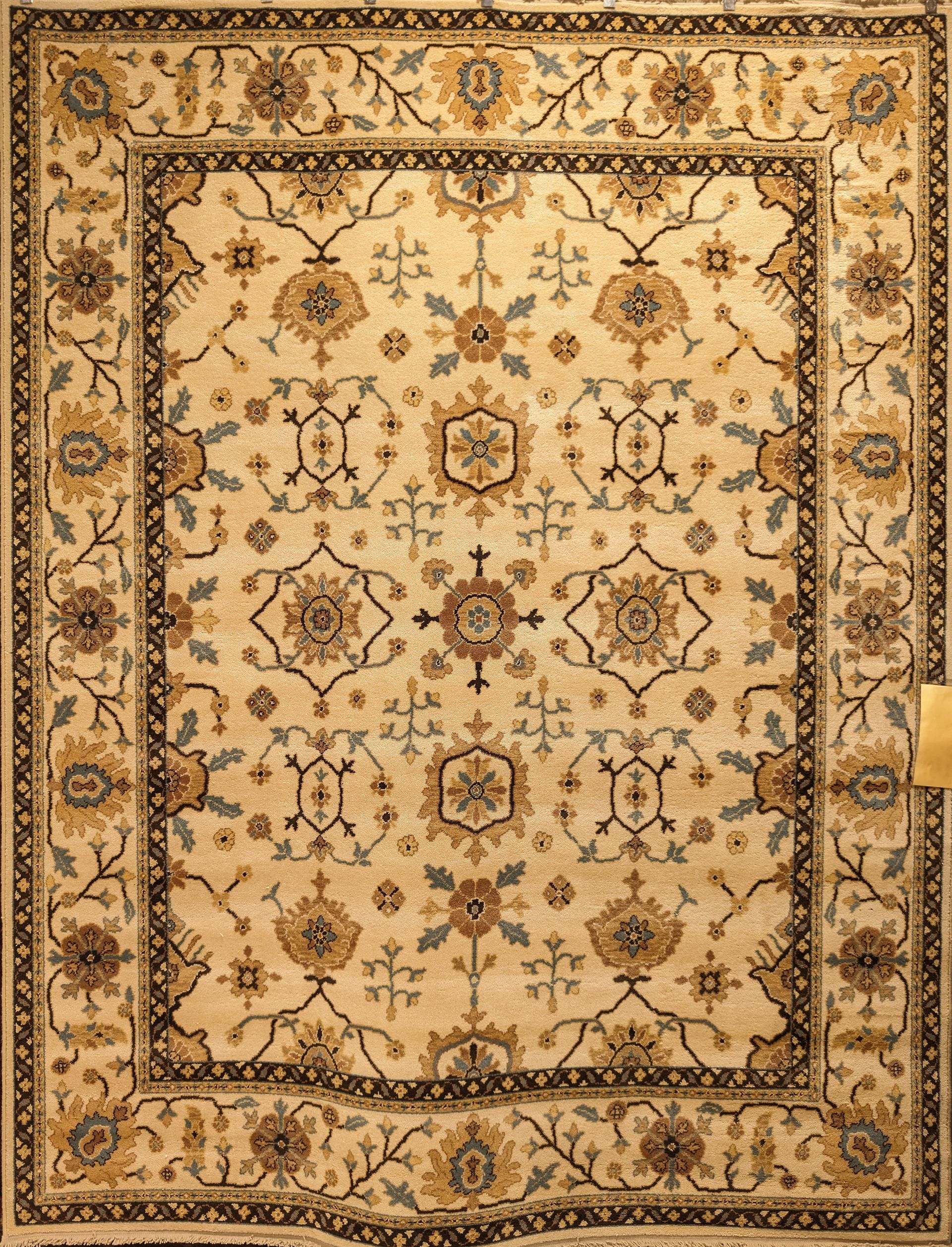 Beige and gold ornate Persian-style rug with floral and geometric patterns