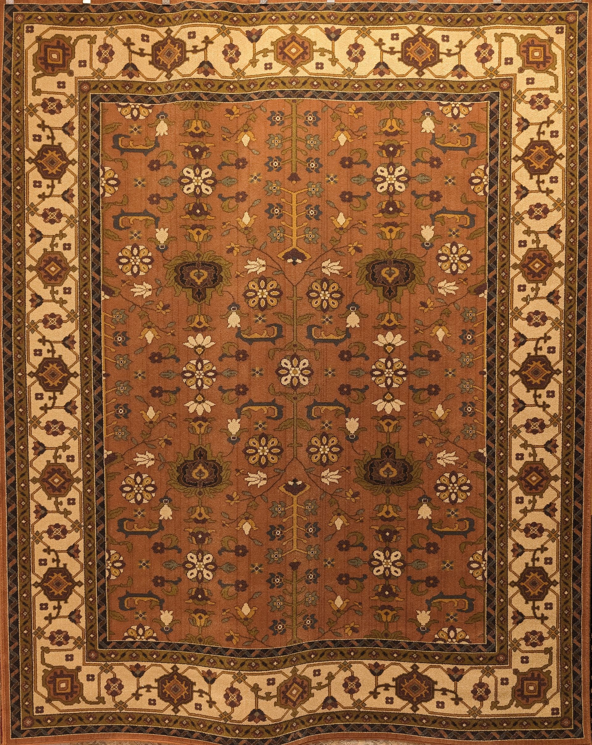 Ornate brown and beige oriental-style rug with floral border and central medallion pattern