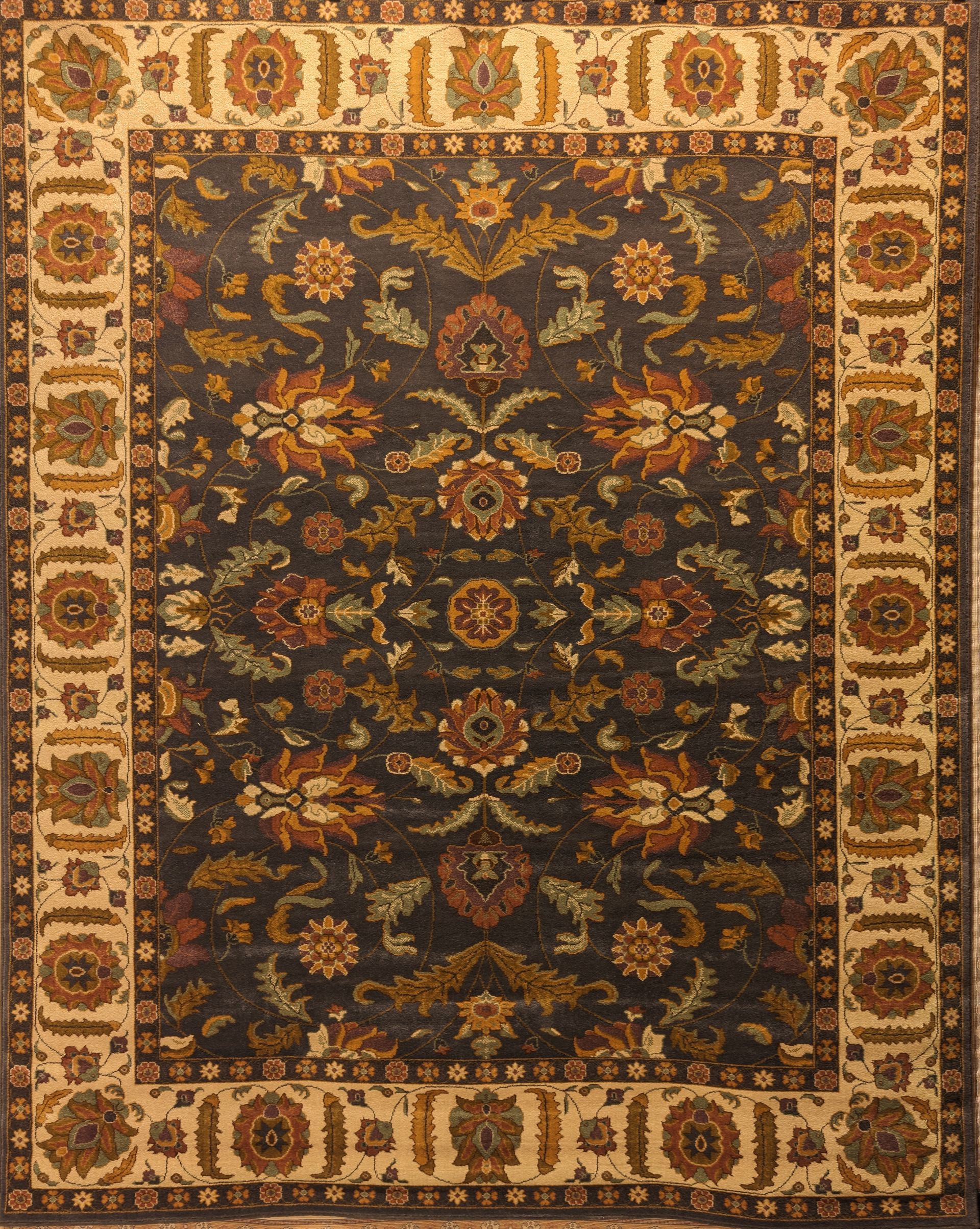 Dark floral Persian-style rug with ornate tan border and central medallion pattern