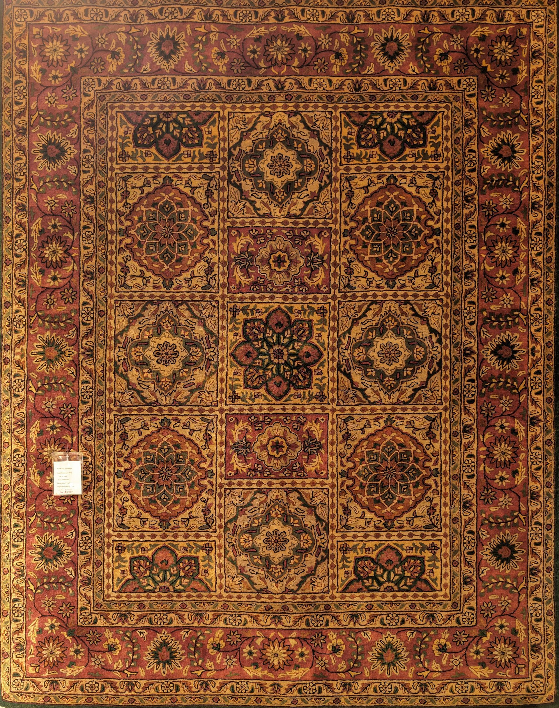 Ornate red and gold patterned oriental rug with geometric floral motifs
