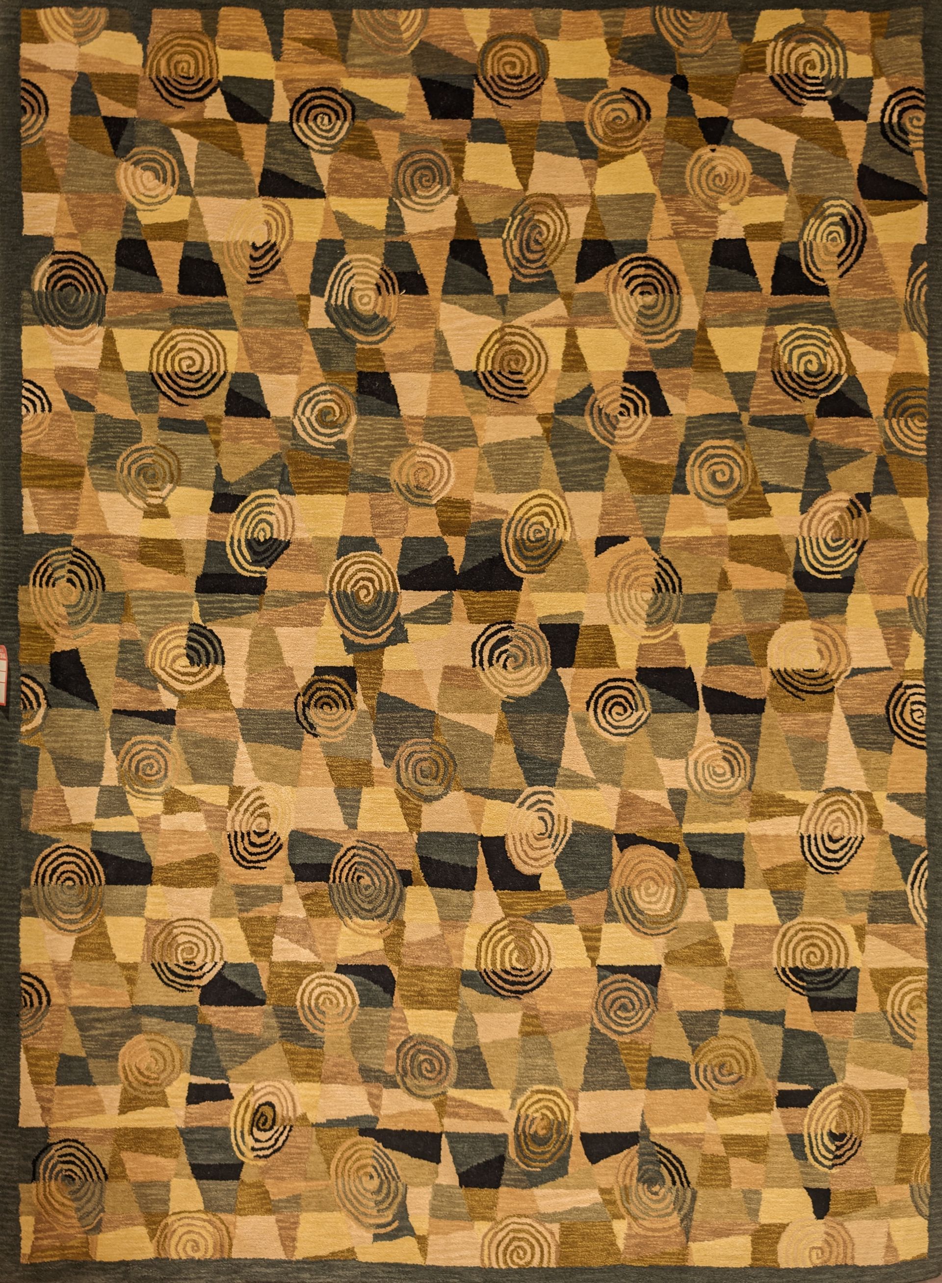 Abstract tan and brown geometric pattern with repeated leaf and spiral motifs