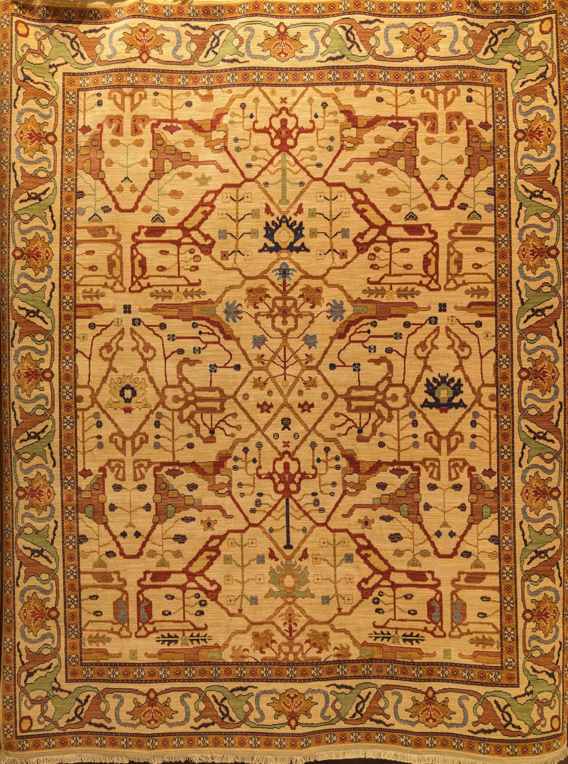Ornate beige Persian-style rug with red, blue, and gold geometric floral patterns