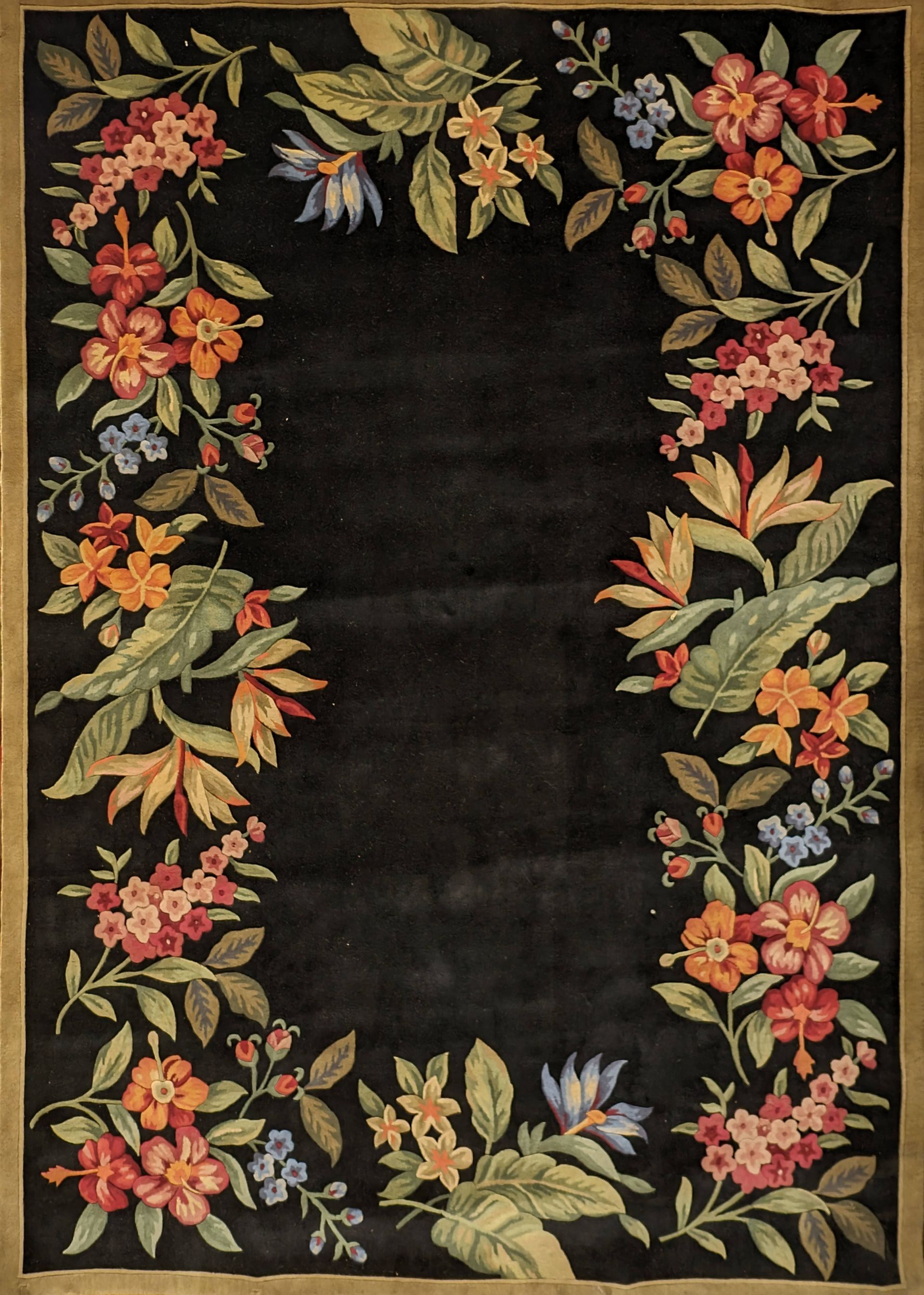 Floral wreath border of orange, pink, and green leaves around a dark empty center