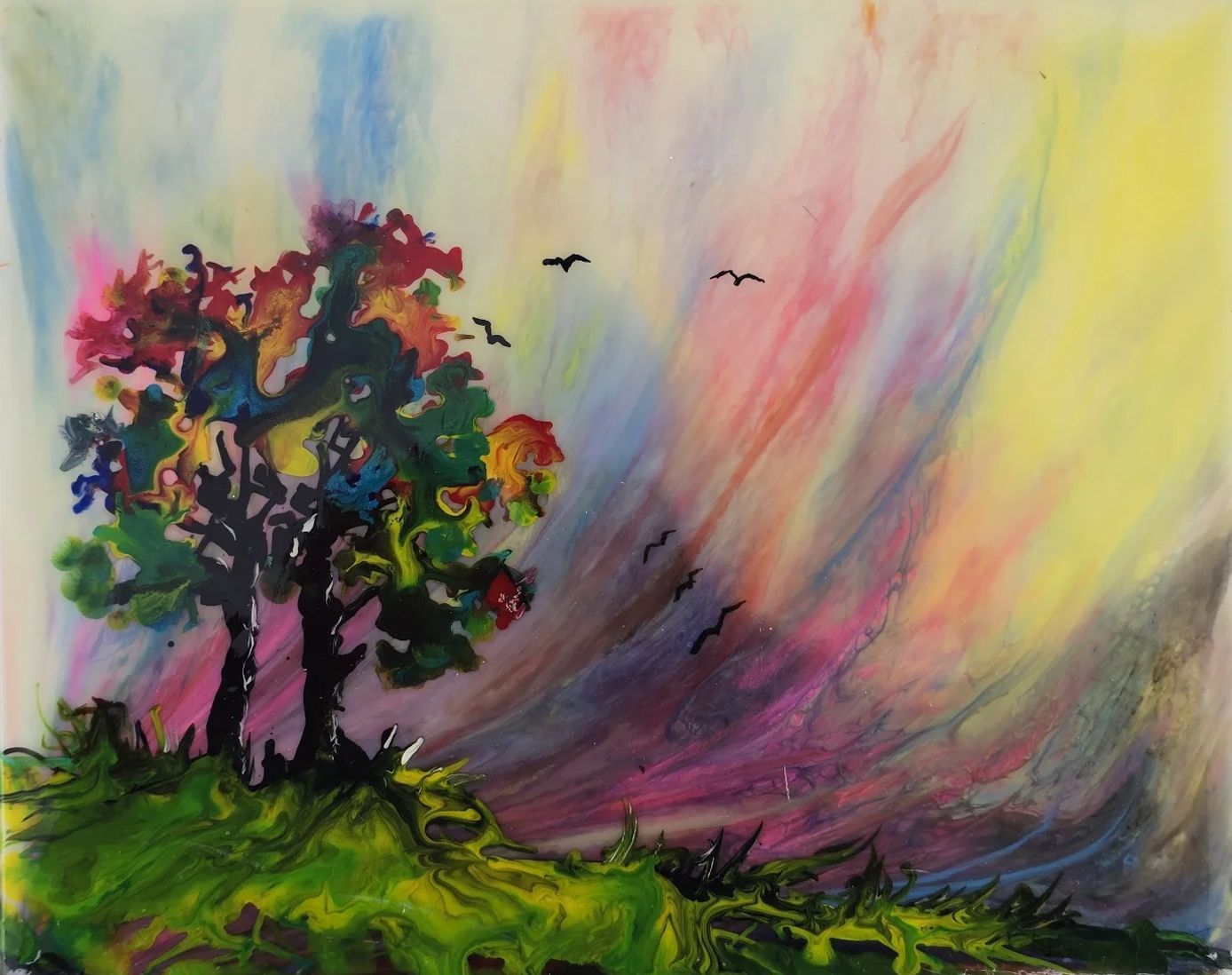 Colorful abstract painting of a tree on a grassy hill with swirling pink, yellow, and purple sky