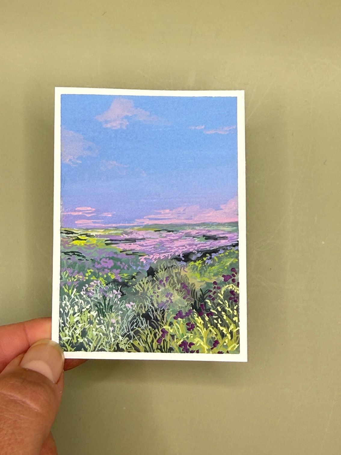 Small landscape painting of a colorful lavender field under a pastel blue and pink sky.