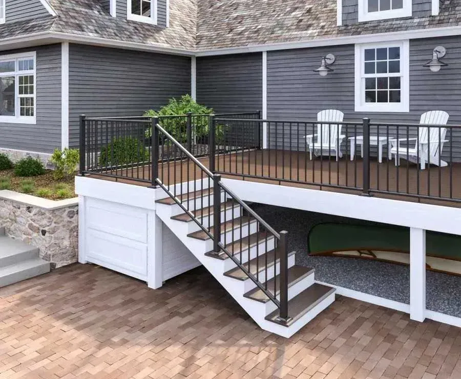 A house with a deck and stairs leading up to it.
