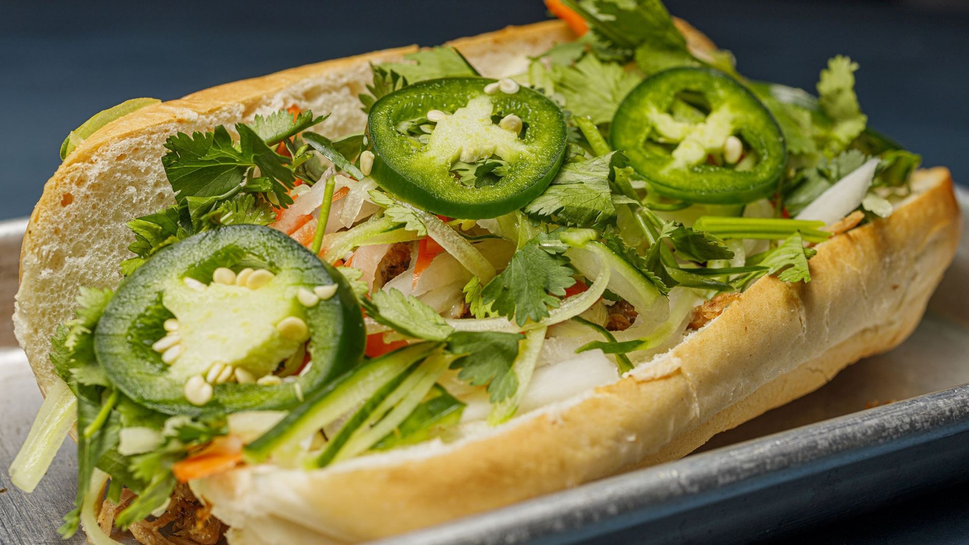 A white plate topped with a salad of lettuce , tomatoes and cheese.